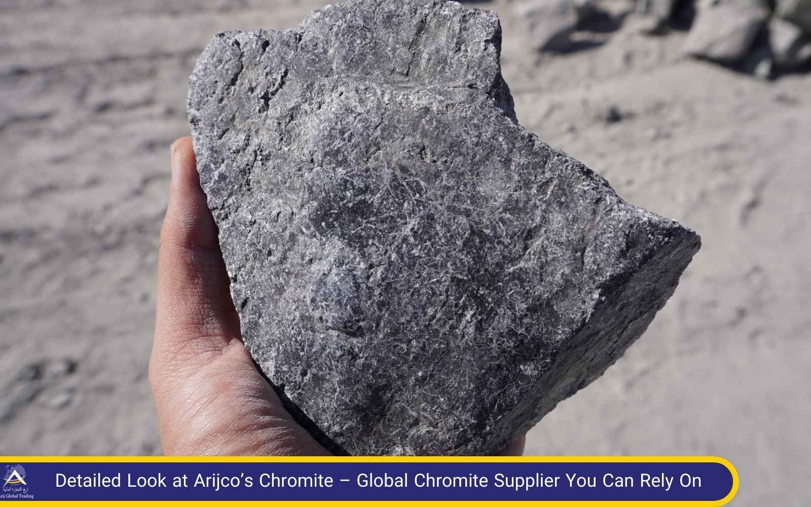 Close-Up of Arijco’s Chromite – High-Grade Ore from a Trusted Chromite Supplier Hand holding a large piece of Arijco’s Chromite ore – showcasing its raw quality and consistency as supplied by a reliable global chromite supplier