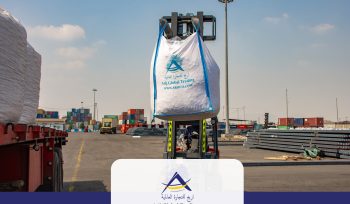 A forklift lifting a heavy-duty jumbo bag of High-Purity Calcined Dolomite branded with the Arijco Global Trading logo at a port yard, ready for export to South Asian steel mills.