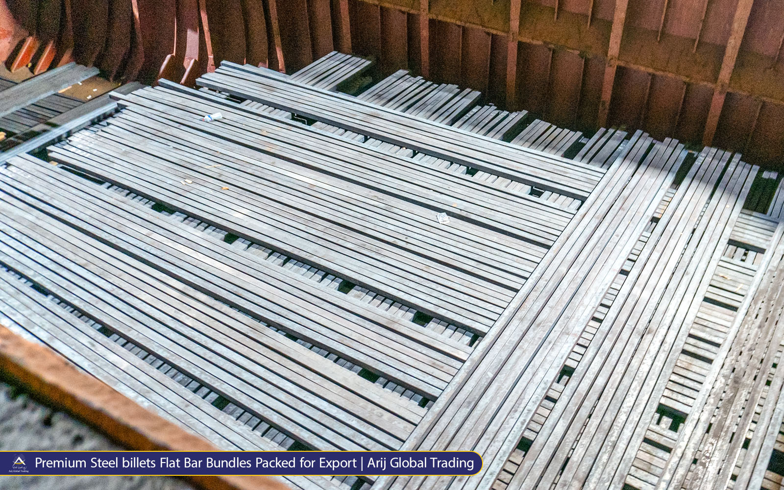 Premium Steel Billet Flat Bar Bundles Packed for Export | Arij Global Trading Red-hot steel beams moving through an industrial mill while oxy-fuel torches cut the heated metal during steel processing.