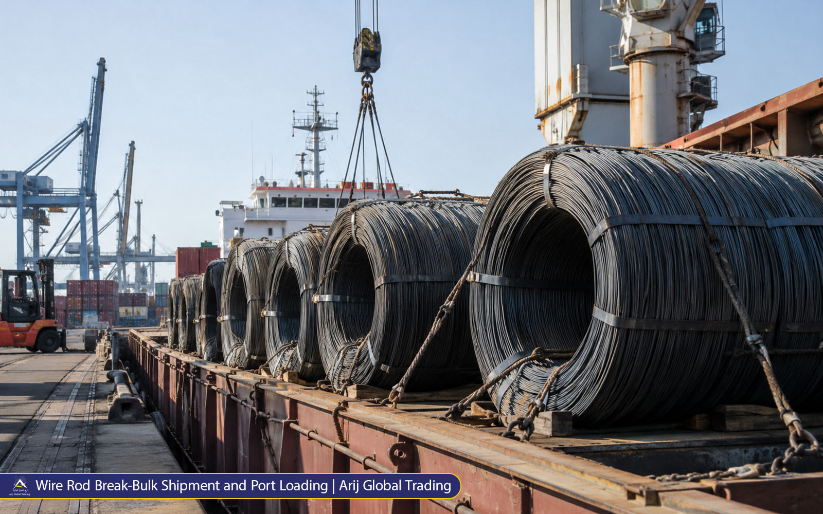 Wire rod coils secured on a break-bulk vessel at a commercial port during international steel cargo loading operations.